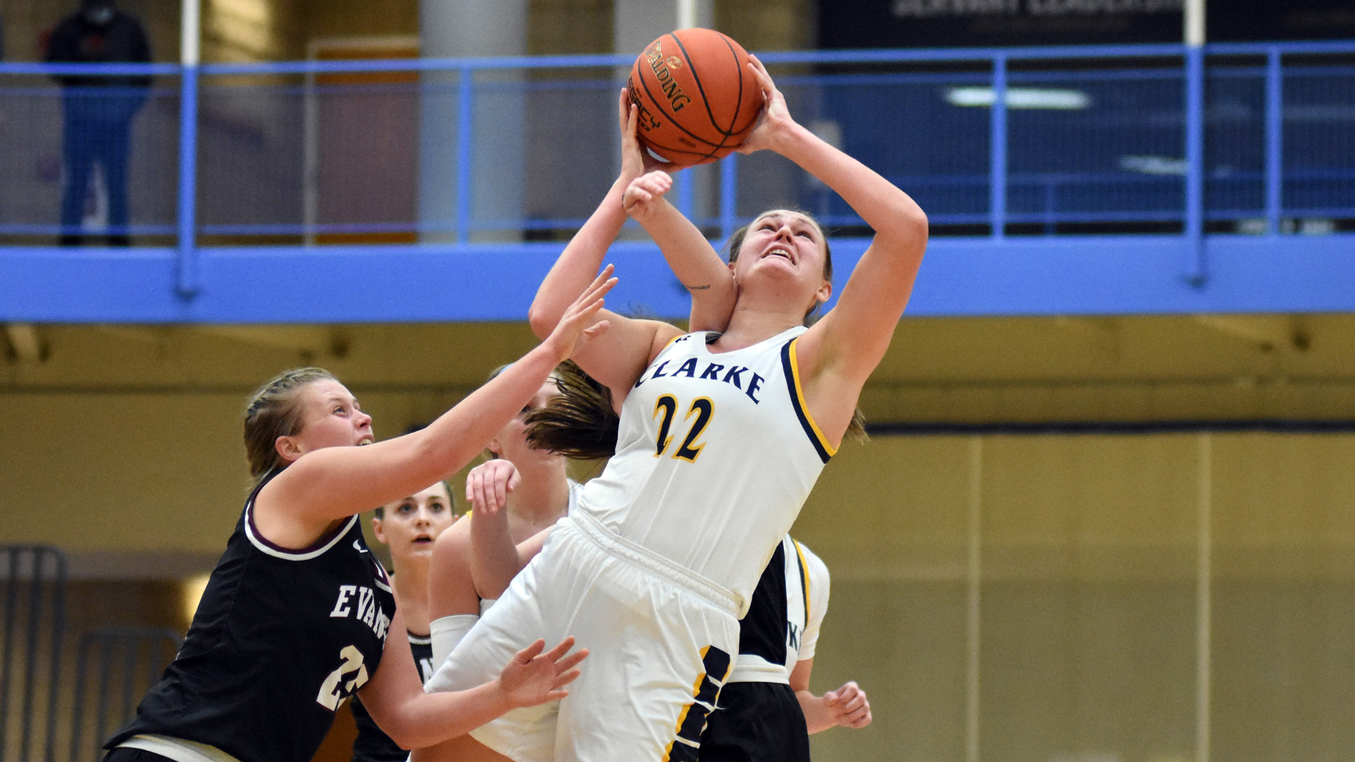 Clarke's Emma Kelchen attempting a shot under defensive pressure