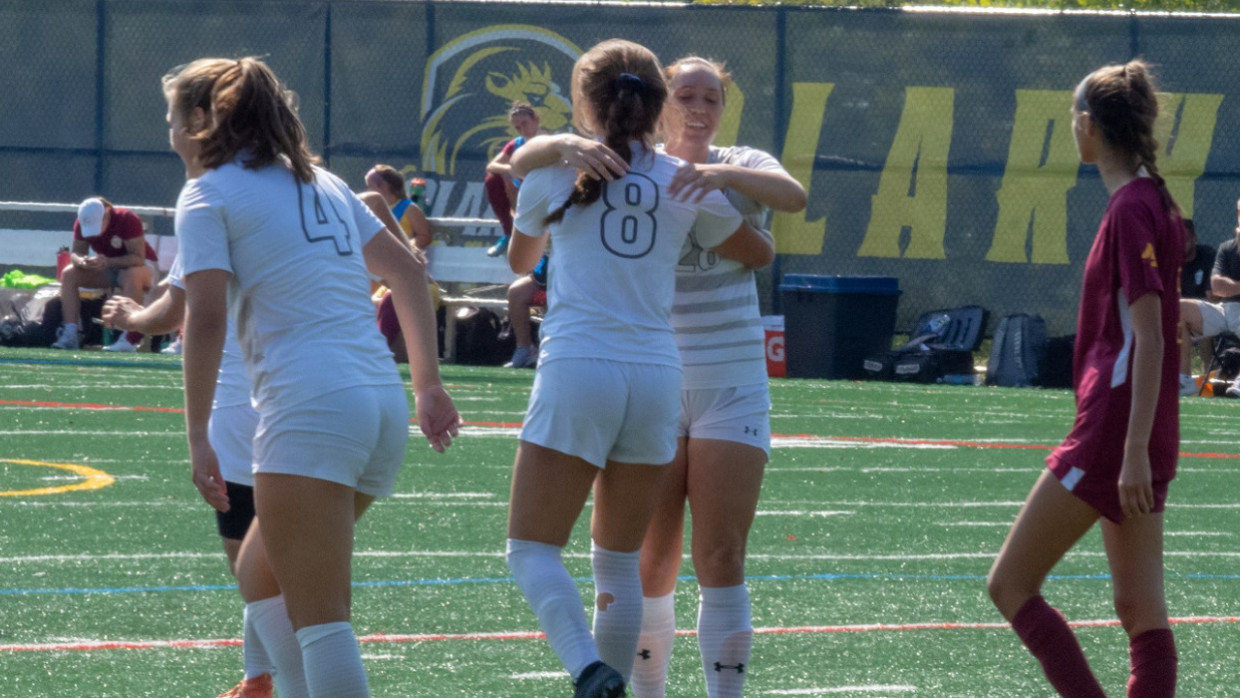 Clarke's Morgan Catchur and Avery Abbas celebrate one of the Pride's goals against Park University